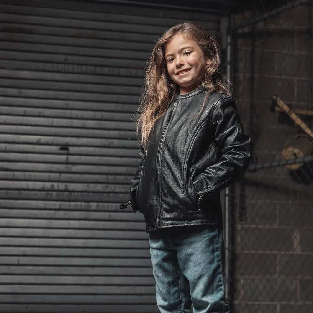 Child wearing Bambino Kid’s Motorcycle Leather Jacket with center zipper and snap pockets