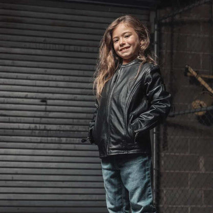 Child wearing Bambino Kid’s Motorcycle Leather Jacket with center zipper and snap pockets
